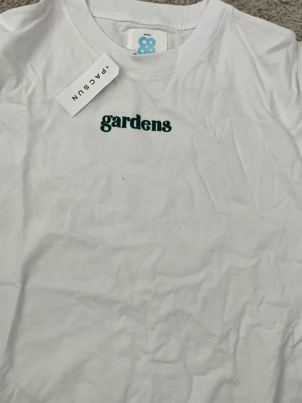 PacSun White Tee with Green "gardens" Logo